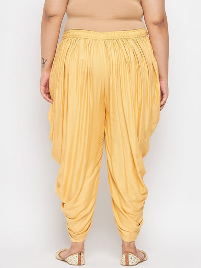 Fawn solid rayon dhoti salwar with elasticated waistband and drawstring.