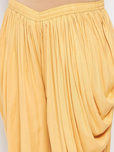 Fawn solid rayon ankle-length dhoti salwar with elastic waistband and drawstring.