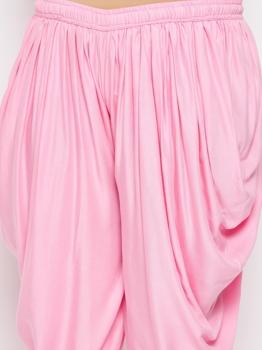 Baby pink solid rayon dhoti salwar with elasticated waistband and drawstring.