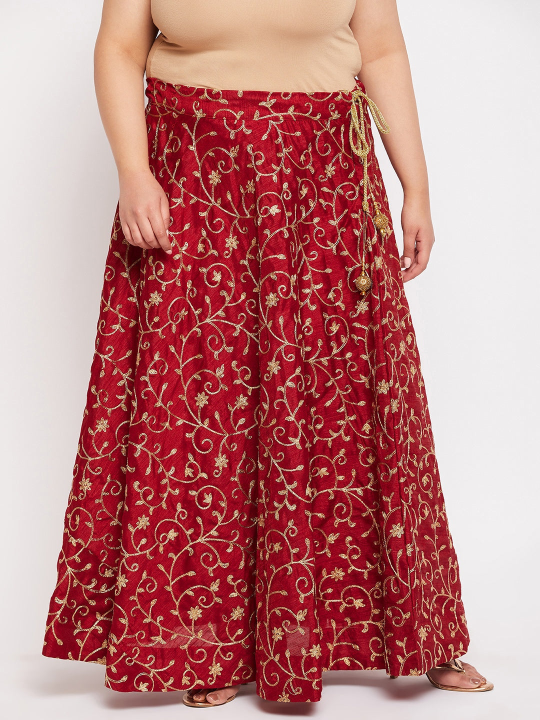 Maroon and gold embroidered flared skirt with drawstring waistband.