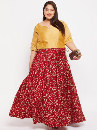 Maroon and gold embroidered flared skirt with drawstring waistband.