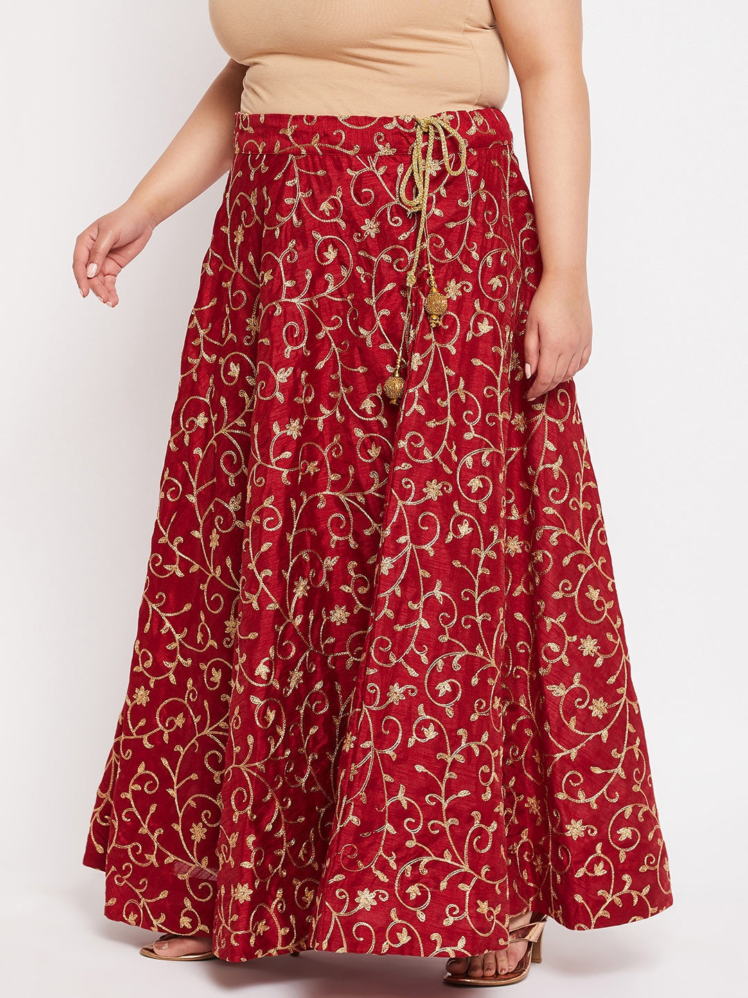 Maroon and gold embroidered flared skirt with drawstring waistband.