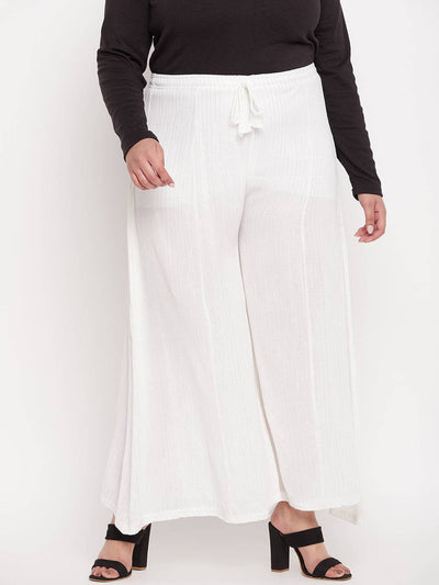 White striped embellished flared sharara with elasticated waistband and drawstring.