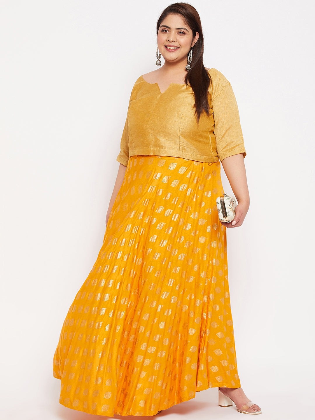 Mustard printed flared rayon skirt with drawstring waistband.