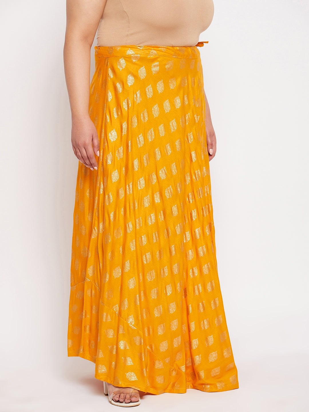 Mustard printed flared rayon skirt with drawstring waistband.