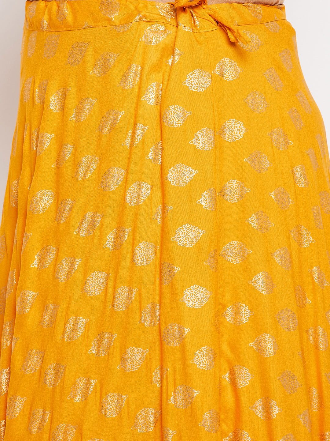 Mustard printed flared rayon skirt with drawstring waistband.