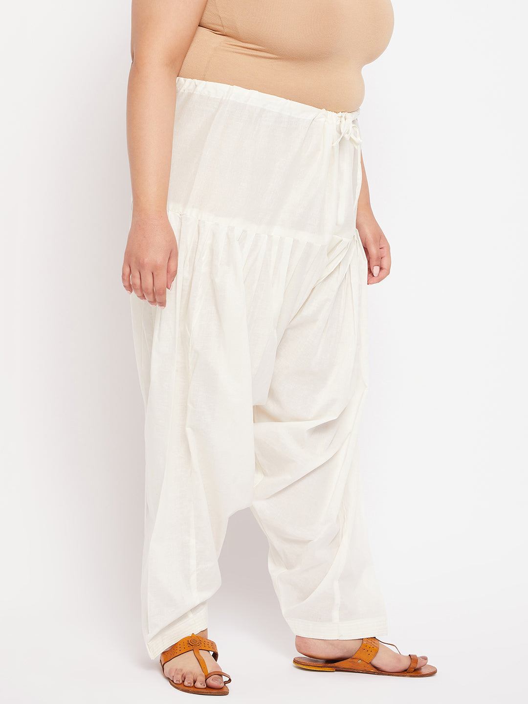 Cream solid semi Patiala cotton salwar with drawstring waistband.