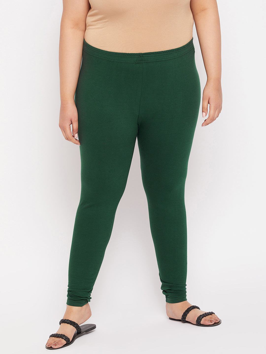 Bottle green solid ankle length leggings with elasticated waistband.
