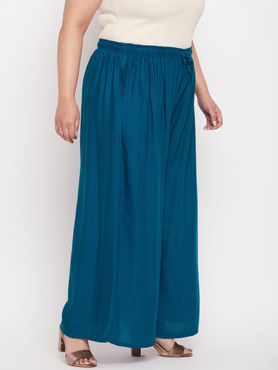 Aqua blue solid rayon jumbo sharara with elasticated waistband and drawstring.