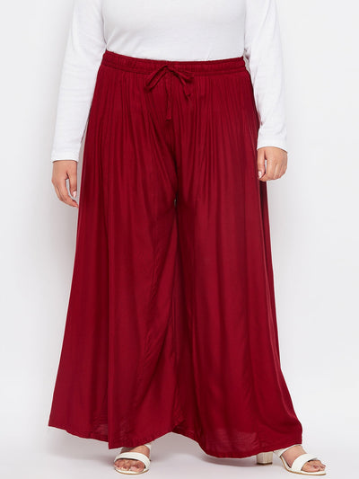 Maroon solid rayon flared sharara with elasticated waistband and drawstring.