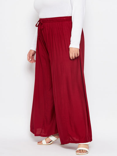 Maroon solid rayon flared sharara with elasticated waistband and drawstring.