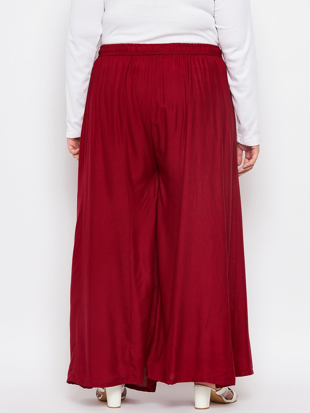 Maroon solid rayon flared sharara with elasticated waistband and drawstring.