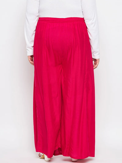 Magenta solid rayon flared sharara with elastic waistband and drawstring.