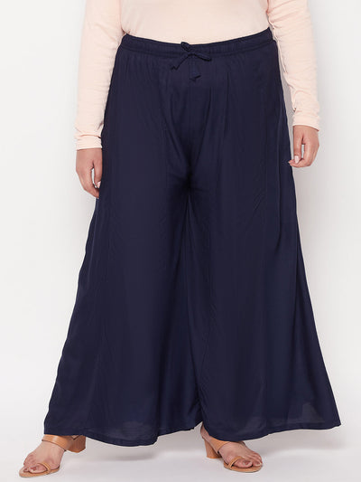 Navy blue solid rayon flared sharara with elasticated waistband and drawstring.
