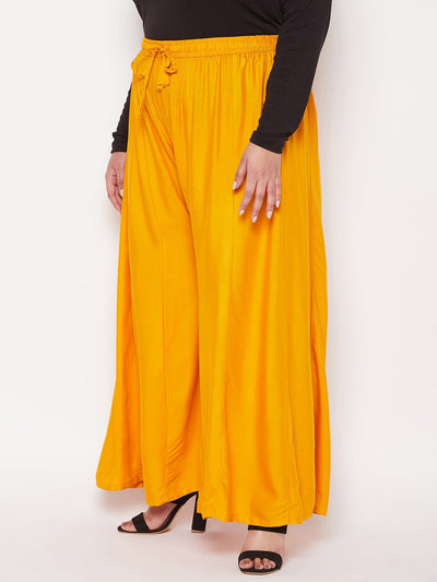 Mustard Solid Rayon Flared Sharara with elasticated waistband and drawstring.