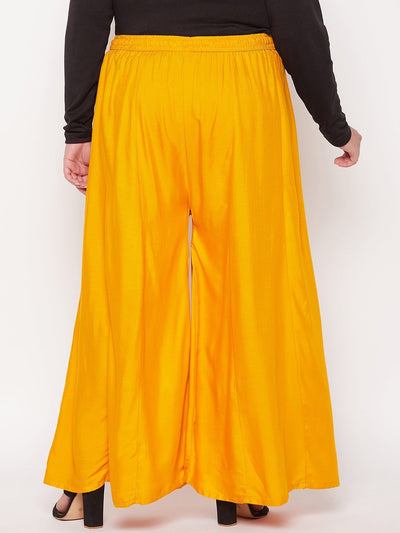 Mustard solid rayon flared sharara with elasticated waistband and drawstring.