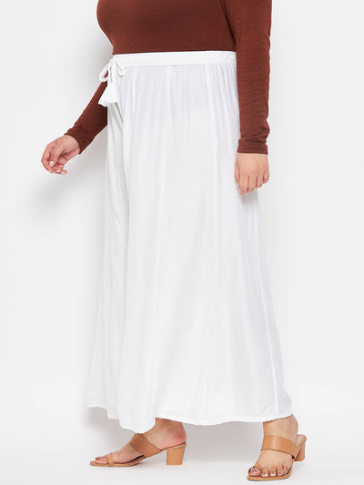 White solid rayon flared sharara with elasticated waistband and drawstring.