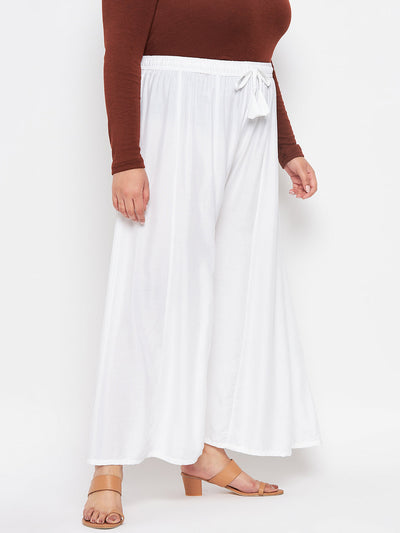 White solid rayon flared sharara with elasticated waistband and drawstring.