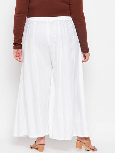 White solid rayon flared sharara with elasticated waistband and drawstring.