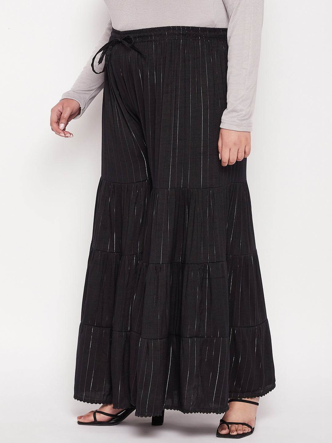 Black striped rayon flared gharara with elasticated waistband and drawstring.
