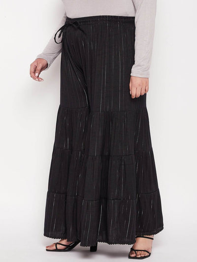Black striped rayon flared gharara with elasticated waistband and drawstring.