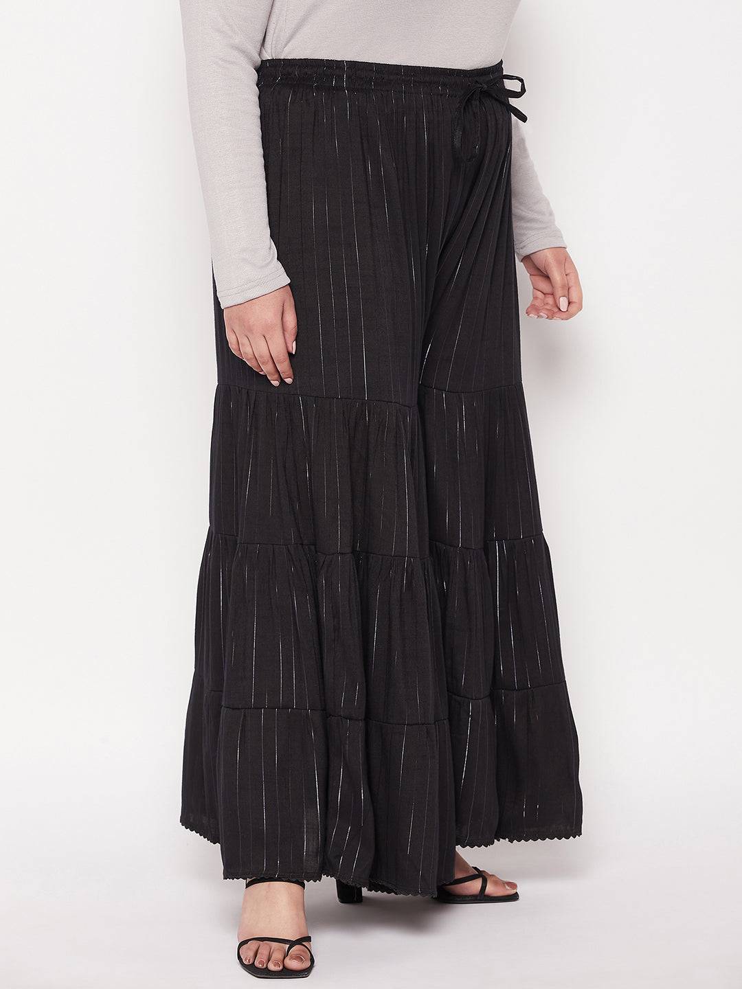 Black striped rayon flared gharara with elasticated waistband and drawstring.