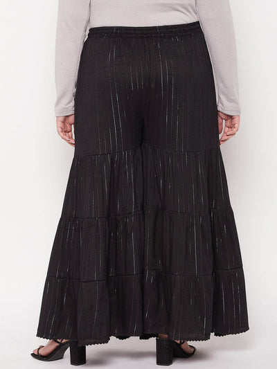 Black striped rayon flared gharara with elasticated waistband and drawstring.