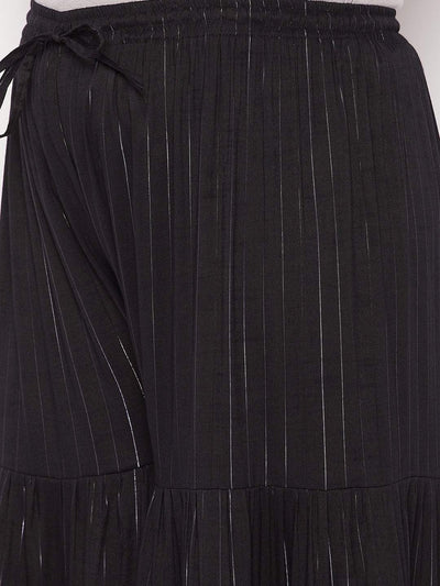 Black striped rayon flared gharara with elasticated waistband and drawstring.