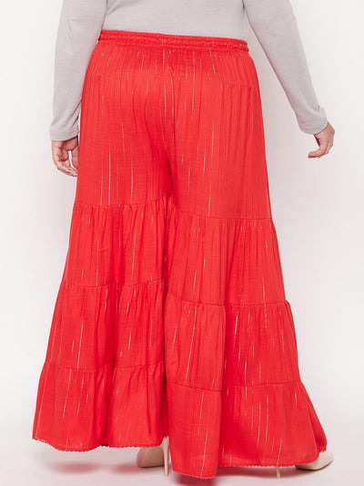Red striped rayon flared gharara with elasticated waistband and drawstring.