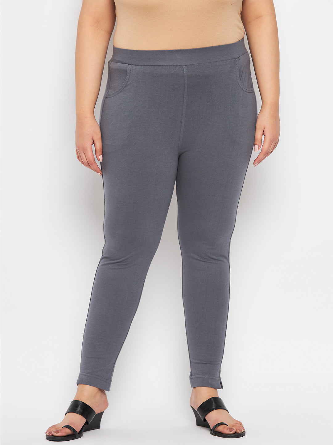 Grey solid ankle length leggings with elasticated waistband.