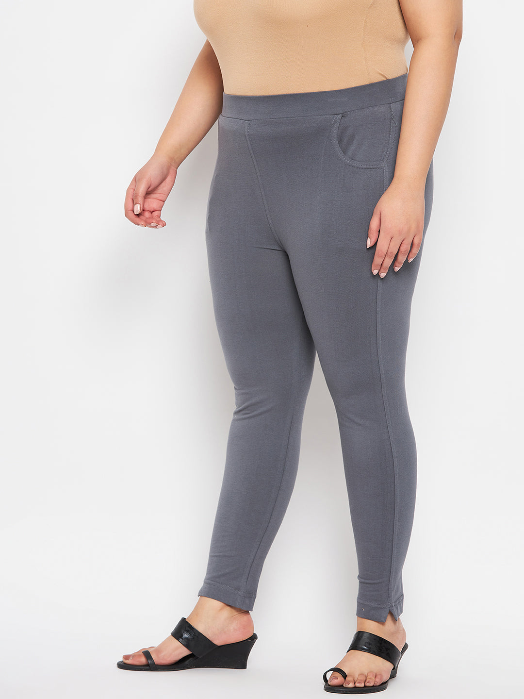Grey solid ankle length leggings with elastic waistband.