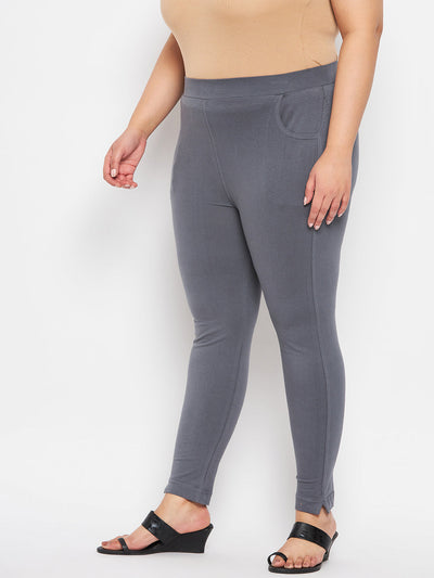 Grey solid ankle length leggings with elastic waistband.