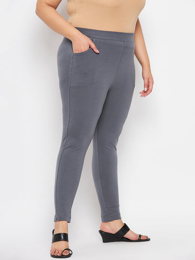 Grey solid ankle length leggings with elasticated waistband.