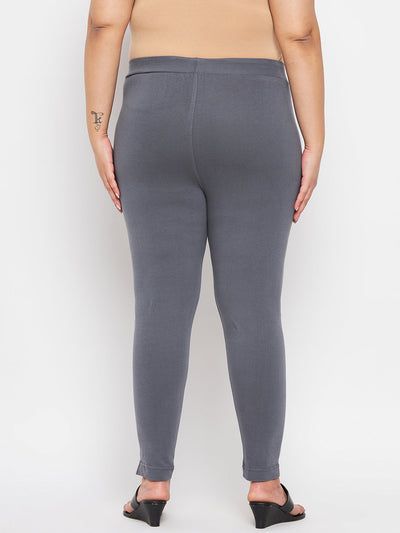 Grey solid ankle length leggings with elasticated waistband, regular fit.