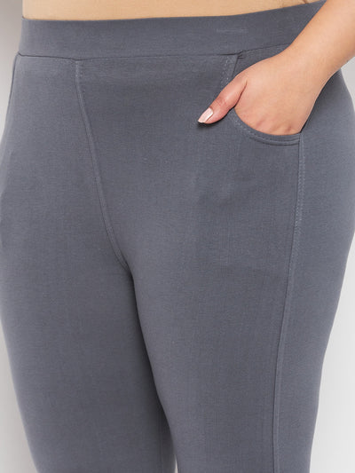 Grey solid ankle length leggings with elasticated waistband.