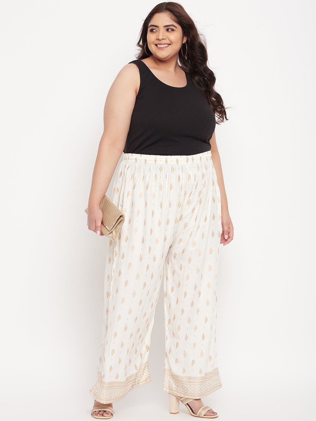 Cream printed wide leg rayon palazzo with elasticated waistband and drawstring.