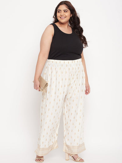 Cream printed wide leg rayon palazzo with elasticated waistband and drawstring.