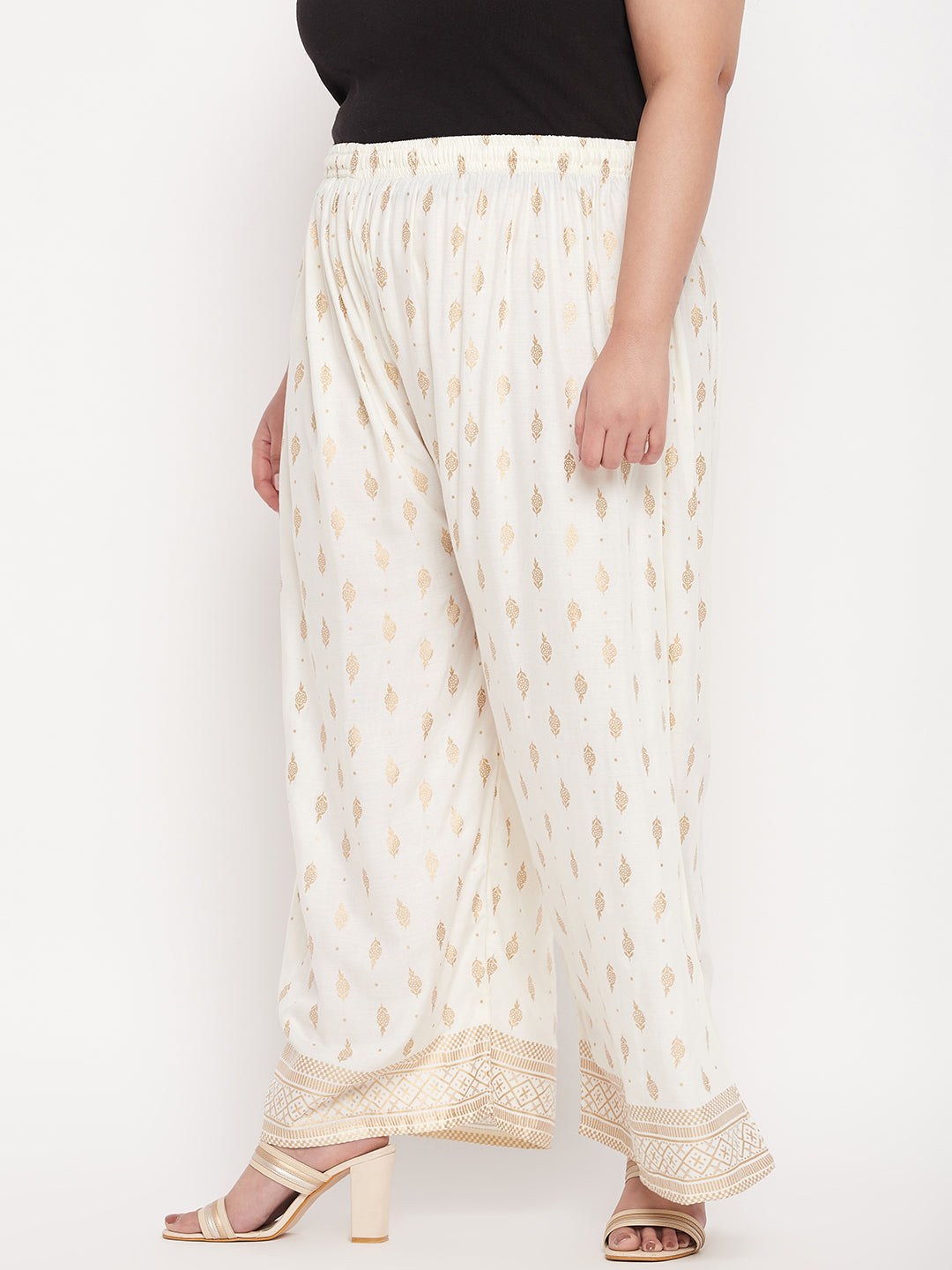 Cream printed wide leg rayon palazzo with elasticated waistband and drawstring.