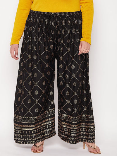 Black printed rayon palazzo with elasticated waistband and drawstring.