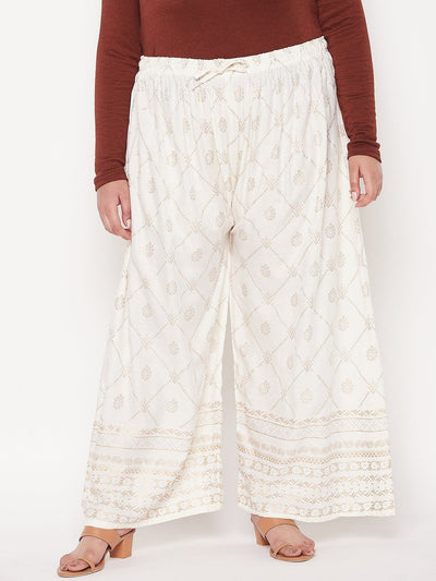 Cream printed rayon palazzo with elasticated waistband and drawstring.