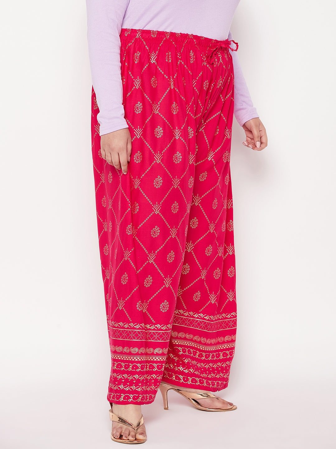 Magenta printed rayon palazzo with elastic waistband and drawstring.