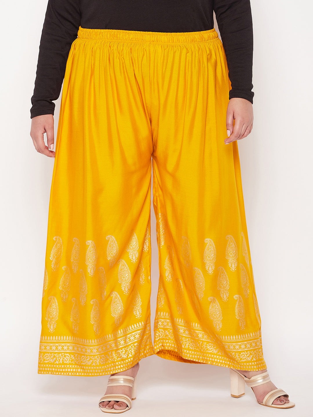 Mustard printed rayon palazzo with wide legs and elasticated waistband.