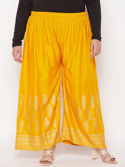 Mustard printed rayon palazzo with wide legs and elasticated waistband.