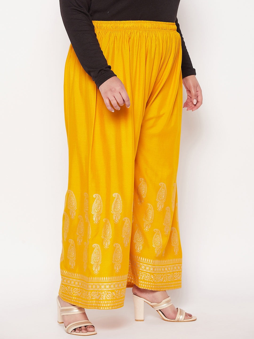 Mustard printed wide leg rayon palazzo with elastic waistband and drawstring.