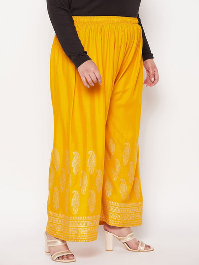 Mustard printed wide leg rayon palazzo with elastic waistband and drawstring.