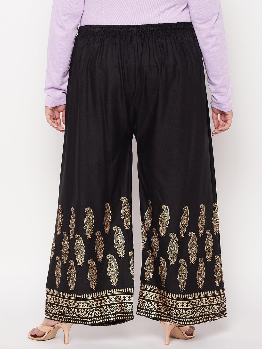 Black printed rayon palazzo with paisley design and elastic waistband.