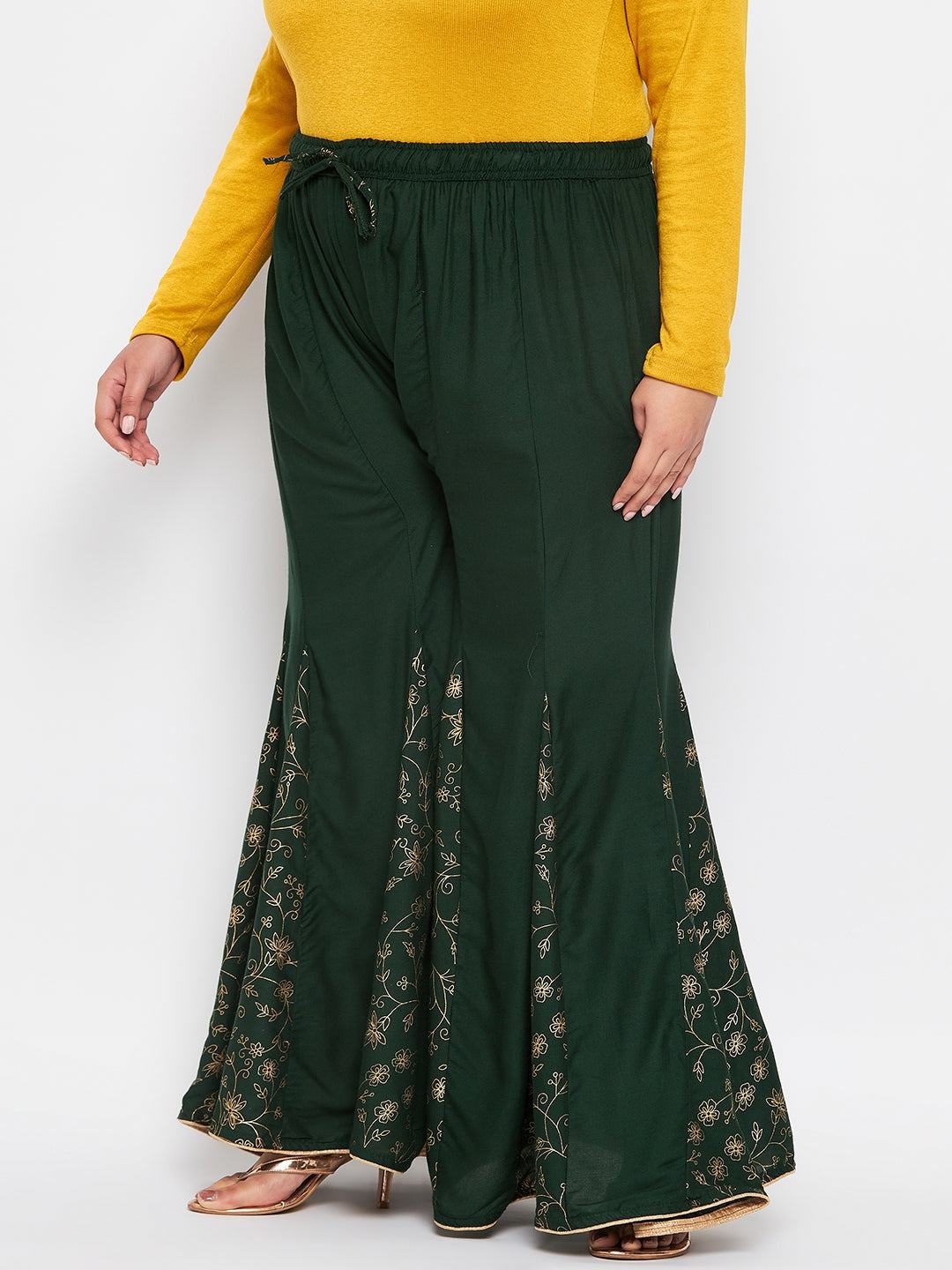 Bottle green printed rayon flared sharara with elasticated waistband and drawstring.