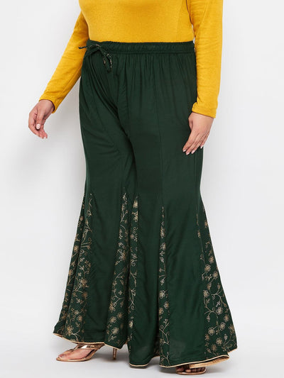 Bottle green printed rayon flared sharara with elasticated waistband and drawstring.