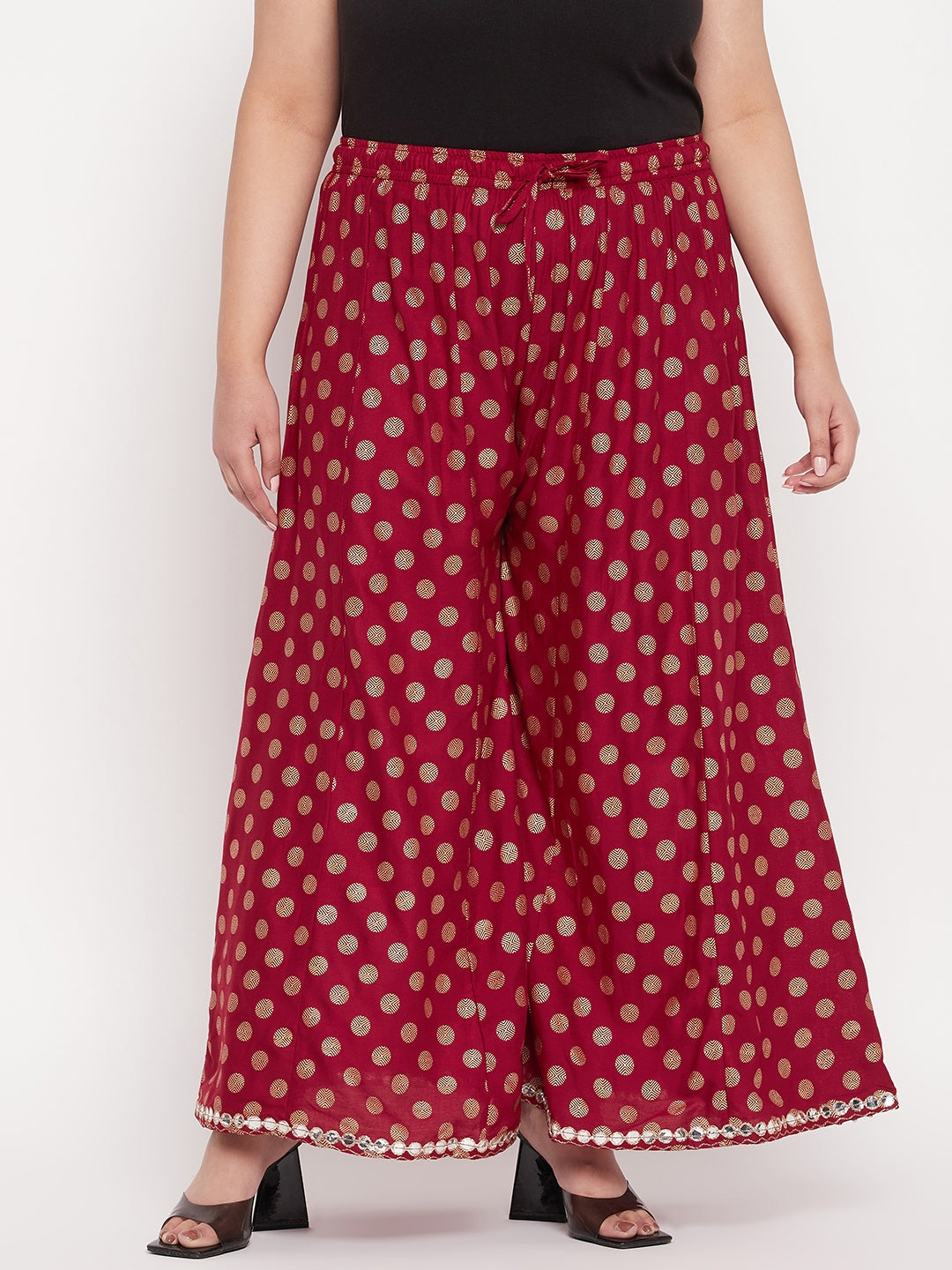 Maroon polka dot rayon sharara with elasticated waistband and drawstring.