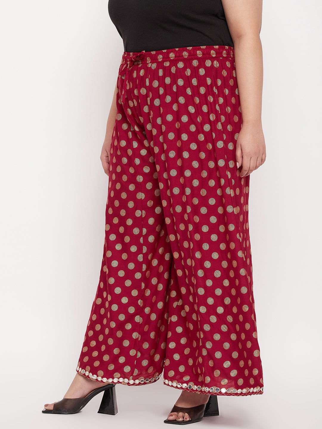 Maroon polka dot rayon sharara with elastic waistband and drawstring.